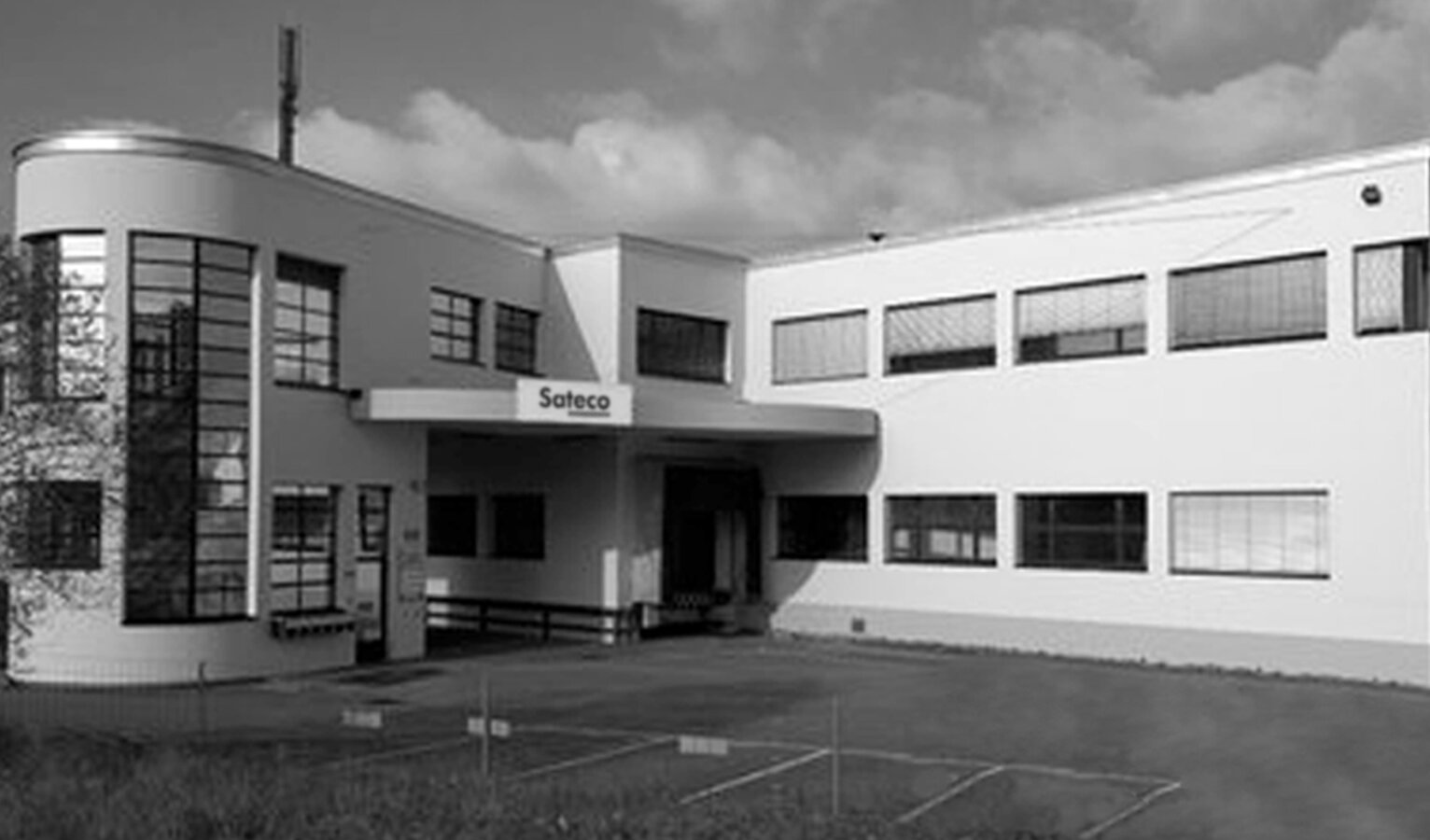 Black and white photo of the building at the former Uster site