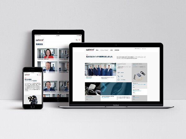 Laptop, Tablet und Handy mit japanischen Seiten von satecogroup.com auf dem Display