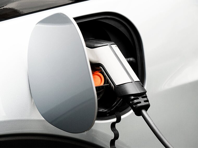 e-chargers close-up of an e-charger in the opening provided on the car